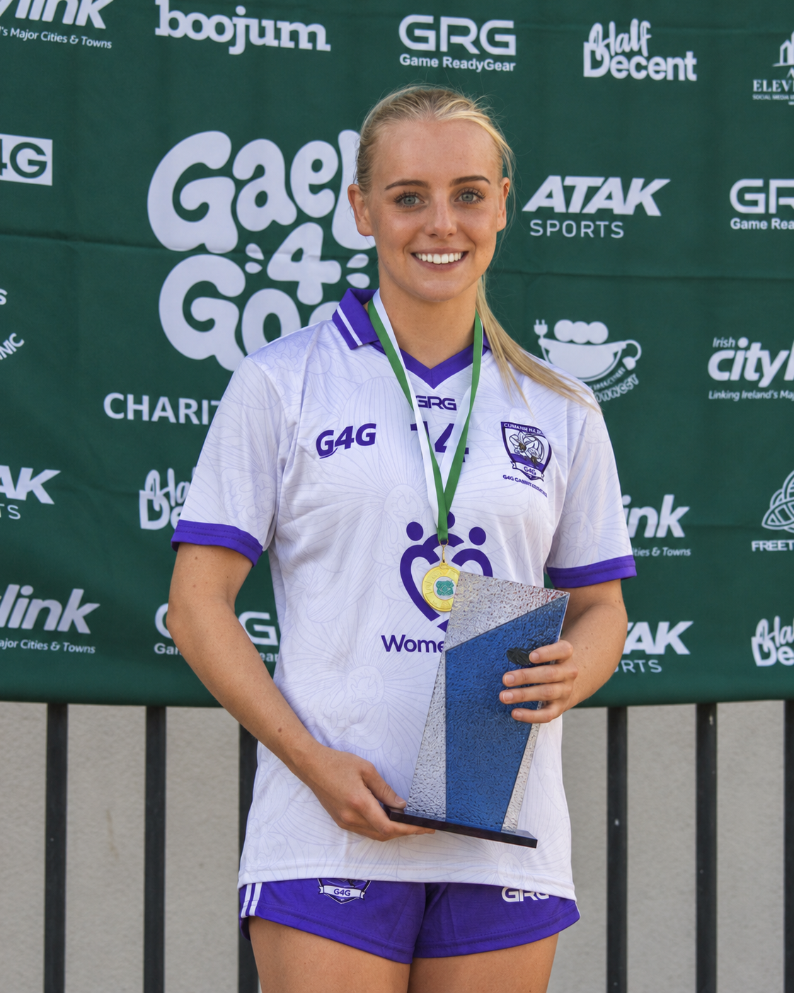 Ellie Murphy holding her Player of the Match award